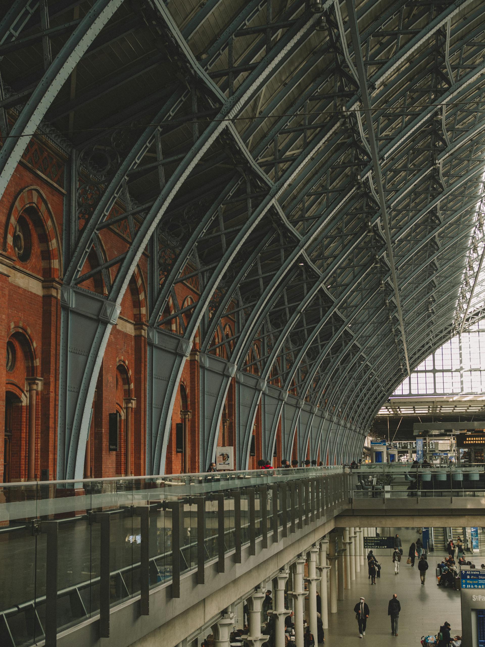 Captivating view of iron and brick architecture in a historic train station interior.